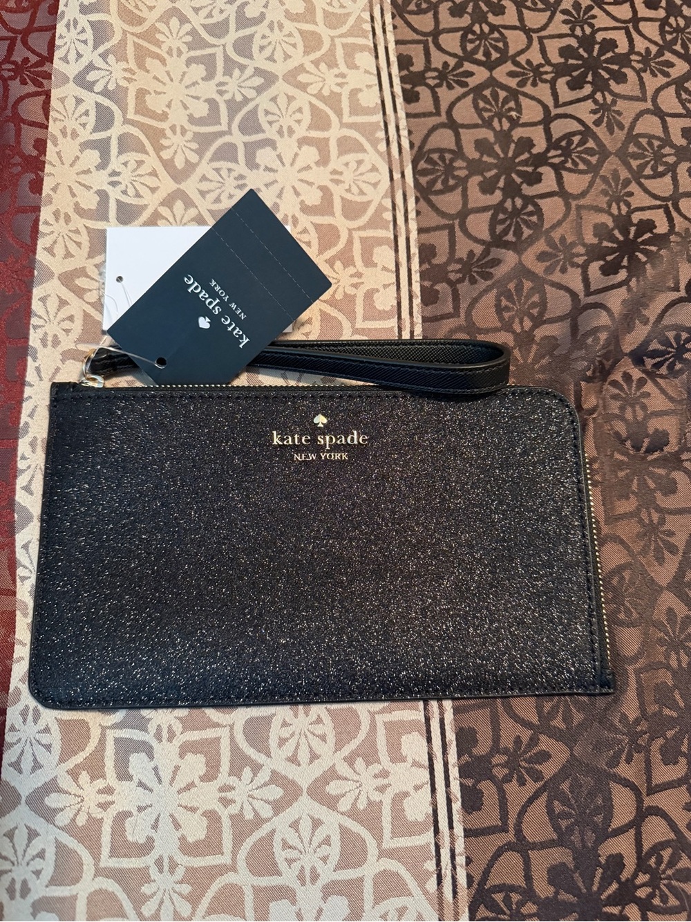 kate spade Black Glitter Wristlet with Gold Logo